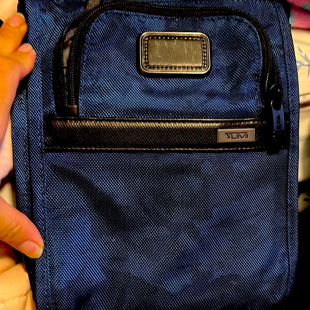 Tumi leather stitch crossbody bag.  Brand new condition.  Men or women
